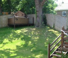 Playhouse and manageable fruit trees planted